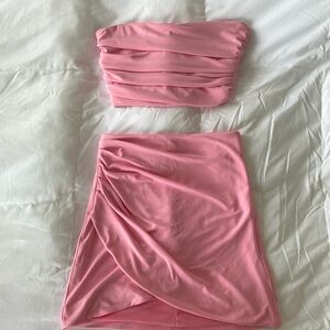 Pink two piece mini skirt and corset crop top set. New without tags never worn.